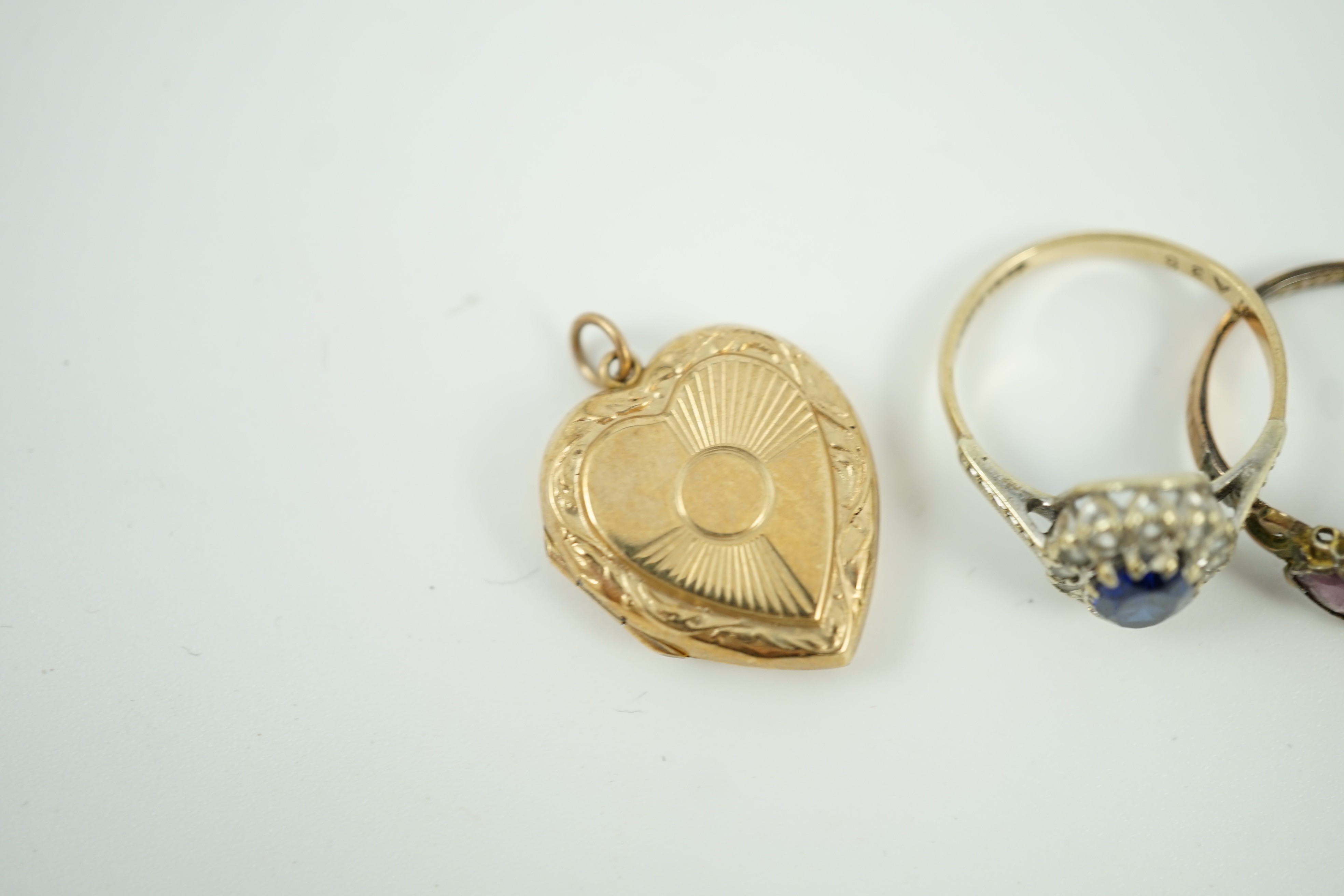 Five assorted 9ct and gem set rings, gross weight 10.9 grams, an 18ct signet ring, 1.8 grams a yellow metal and cultured pearl ring and a 9ct back and front heart locket.